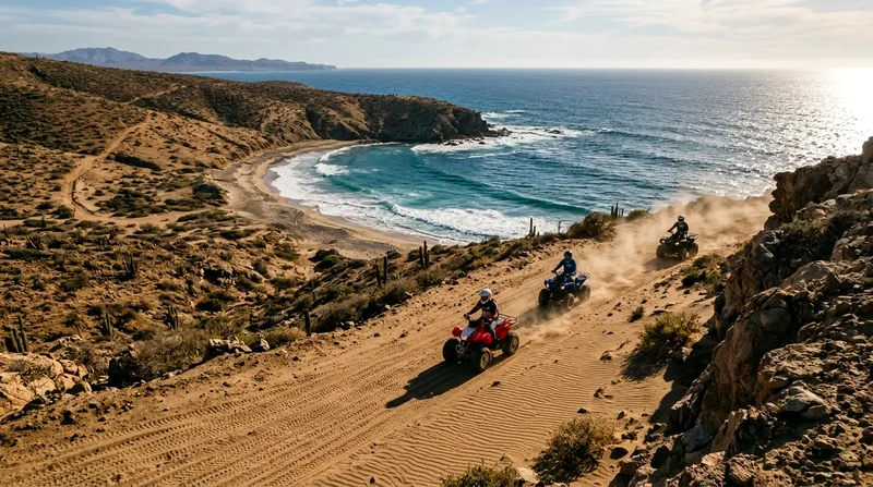 Three ATV riders heading toward a Pacific coast cove after desert trail.
